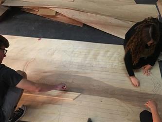 Students drawing plans